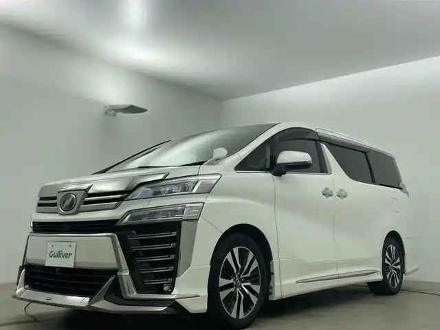 トヨタ ヴェルファイア Z Gエディション 岡山県 2018(平30)年 7.7万km ホワイトパールクリスタルシャイン アルパインＢＩＧＸ１１インチナビ/（HDMI接続/Bluetooth/フルセグTV）/アルパイン１２．８インチフリップダウンモニター/サンルーフ/本革/モデリスタフルエアロ/衝突軽減ブレーキ/レーダークルーズコントロール/ビルトインＥＴＣ/三眼ＬＥＤヘッドライト/オートハイビーム/シートヒーター/エアシート/ステアリングヒーター/コーナーセンサー/プッシュスタート/スマートキー/パワーシート/純正フロアマット/純正18インチアルミホイール＋サマータイヤ：装着/両側電動スライドドア/踏み間違い防止