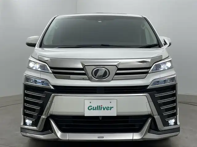 トヨタ ヴェルファイア Z Gエディション 岡山県 2018(平30)年 7.7万km ホワイトパールクリスタルシャイン アルパインＢＩＧＸ１１インチナビ/（HDMI接続/Bluetooth/フルセグTV）/アルパイン１２．８インチフリップダウンモニター/サンルーフ/本革/モデリスタフルエアロ/衝突軽減ブレーキ/レーダークルーズコントロール/ビルトインＥＴＣ/三眼ＬＥＤヘッドライト/オートハイビーム/シートヒーター/エアシート/ステアリングヒーター/コーナーセンサー/プッシュスタート/スマートキー/パワーシート/純正フロアマット/純正18インチアルミホイール＋サマータイヤ：装着/両側電動スライドドア/踏み間違い防止