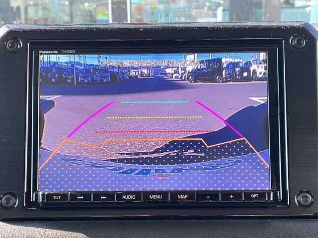 スズキ ジムニー シエラ JC 長野県 2023(令5)年 2.7万km ミディアムグレー 禁煙車/ワンオーナー/純正SDナビ/フルセグTV/バックカメラ/（Bluetooth/CD/DVD/HDMI）/社外１５インチアルミ（ＮＩＴＲＯ　ＰＯＷＥＲ）/前席シートヒーター/背面スペアタイヤ/クルーズコントロール/アイドリングストップ/衝突被害軽減システム/横滑り防止装置/レーンキープアシスト/ダウンヒルアシストコントロール/LEDヘッドライト/ウインカーミラー/社外フロアマット/カーテンエアバッグ/高低速2段切替レバー /ステアリングスイッチ/プッシュスタート/スマートキー