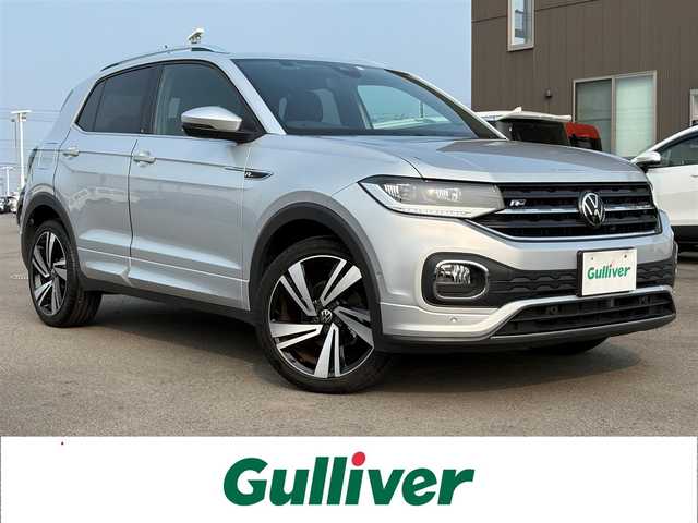 フォルクスワーゲン ＶＷ Ｔ－クロス TSI Rライン 徳島県 2023(令5)年 1.4万km シルバー 純正ナビ/ハーフレザーシート/置くだけ充電/前後ドライブレコーダー/ＨＩＤヘッドライト/ＥＴＣ/タイプＣ充電/ＭＴモード付ＡＴ/ルーフレール/パーキングアシスト機能/プッシュスタート