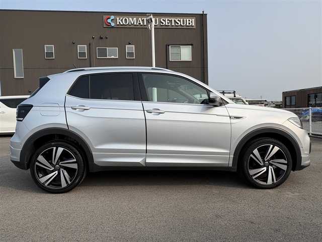 フォルクスワーゲン ＶＷ Ｔ－クロス TSI Rライン 徳島県 2023(令5)年 1.4万km シルバー 純正ナビ/ハーフレザーシート/置くだけ充電/前後ドライブレコーダー/ＨＩＤヘッドライト/ＥＴＣ/タイプＣ充電/ＭＴモード付ＡＴ/ルーフレール/パーキングアシスト機能/プッシュスタート