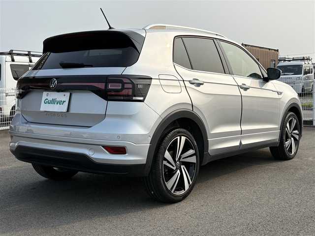 フォルクスワーゲン ＶＷ Ｔ－クロス TSI Rライン 徳島県 2023(令5)年 1.4万km シルバー 純正ナビ/ハーフレザーシート/置くだけ充電/前後ドライブレコーダー/ＨＩＤヘッドライト/ＥＴＣ/タイプＣ充電/ＭＴモード付ＡＴ/ルーフレール/パーキングアシスト機能/プッシュスタート
