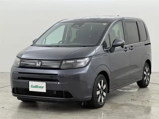 ホンダ フリード ハイブリット e:HEV AIR EX 福岡県 2025(令7)年 0.1千km メテオロイドグレーメタリック 登録済未使用車　/純正９型ナビ（フルセグＴＶ）　/ホンダセンシング　/盗難防止装置　/ＢＳＭ　/レーダークルコン　/両側パワースライドドア　/シートヒーター　/リアクーラー　/ＬＥＤヘッドライト　/純正アルミホイール