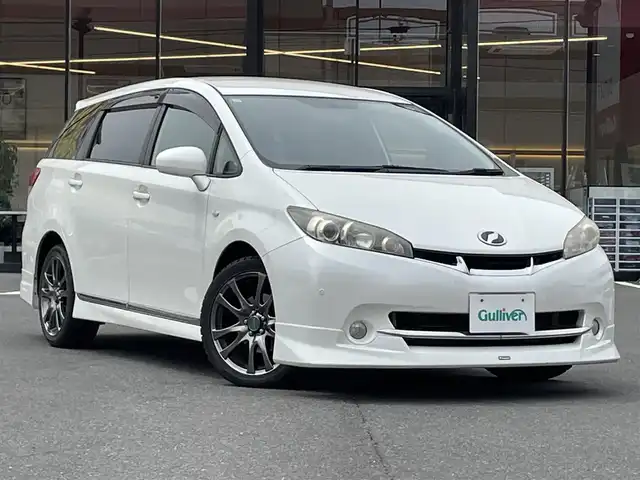 トヨタ ウィッシュ 1．8S 宮城県 2009(平21)年 15.3万km ホワイトパールクリスタルシャイン 走行距離：153604km/エアロ有/ＭＴ付ＡＴ/ＥＴＣ/スペアキー/Ｂカメ/エンジンスタートボタン/社外フロアマット/予備タイヤ/USB/BT/SDナビ/フルフラットシート/スタッドレス