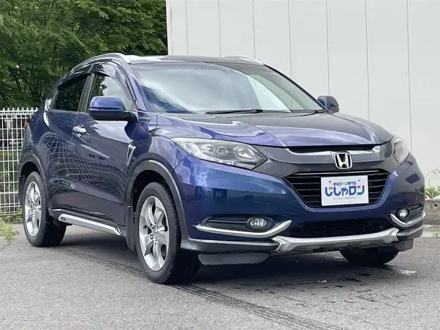 ホンダ ヴェゼル ハイブリッド X 福島県 2015(平27)年 12.6万km モルフォブルーP (株)IDOMが運営する【じしゃロン福島店】の自社ローン専用車両になります。こちらは現金またはオートローンご利用時の価格です。自社ローンご希望の方は別途その旨お申付け下さい/純正メモリナビ（VXM-155VSi）/ワンセグテレビ/バックカメラ/モデューロエアロ/革巻ステアリング/ステアリングリモコン/ドライブレコーダー/パドルシフト/ＥＴＣ/車両接近アラーム/フロントフォグランプ