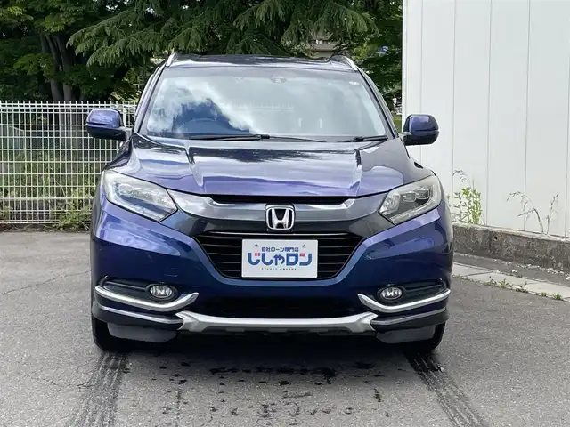 ホンダ ヴェゼル ハイブリッド X 福島県 2015(平27)年 12.6万km モルフォブルーP (株)IDOMが運営する【じしゃロン福島店】の自社ローン専用車両になります。こちらは現金またはオートローンご利用時の価格です。自社ローンご希望の方は別途その旨お申付け下さい/純正メモリナビ（VXM-155VSi）/ワンセグテレビ/バックカメラ/モデューロエアロ/革巻ステアリング/ステアリングリモコン/ドライブレコーダー/パドルシフト/ＥＴＣ/車両接近アラーム/フロントフォグランプ