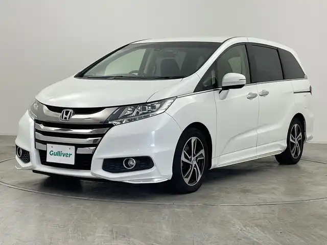 ホンダ オデッセイ アブソルート・Xホンダセンジング 群馬県 2016(平28)年 6.7万km ホワイトオーキッドパール ・純正ギャザーズナビ ＜フルセグTV＞/・バックモニター/・両側パワースライドドア/・レーダークルーズコントロール/・ビルトインETC/・パワーシート/・レーンアシスト/・横滑り防止装置/・盗難防止装置/・オートライト/・ホンダセンシング/・スマートキー/・エンジンスタートボタン/・ハーフレザーシート/・SRSエアバッグ（運転席/助手席/サイド/カーテン）/・LEDヘッドライト/・純正１７インチアルミホイール