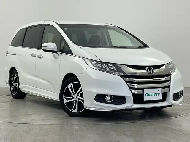 ホンダ オデッセイ アブソルート・Xホンダセンジング 群馬県 2016(平28)年 6.7万km ホワイトオーキッドパール ・純正ギャザーズナビ ＜フルセグTV＞/・バックモニター/・両側パワースライドドア/・レーダークルーズコントロール/・ビルトインETC/・パワーシート/・レーンアシスト/・横滑り防止装置/・盗難防止装置/・オートライト/・ホンダセンシング/・スマートキー/・エンジンスタートボタン/・ハーフレザーシート/・SRSエアバッグ（運転席/助手席/サイド/カーテン）/・LEDヘッドライト/・純正１７インチアルミホイール