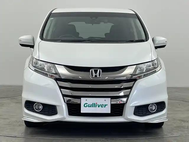 ホンダ オデッセイ アブソルート・Xホンダセンジング 群馬県 2016(平28)年 6.7万km ホワイトオーキッドパール ・純正ギャザーズナビ ＜フルセグTV＞/・バックモニター/・両側パワースライドドア/・レーダークルーズコントロール/・ビルトインETC/・パワーシート/・レーンアシスト/・横滑り防止装置/・盗難防止装置/・オートライト/・ホンダセンシング/・スマートキー/・エンジンスタートボタン/・ハーフレザーシート/・SRSエアバッグ（運転席/助手席/サイド/カーテン）/・LEDヘッドライト/・純正１７インチアルミホイール