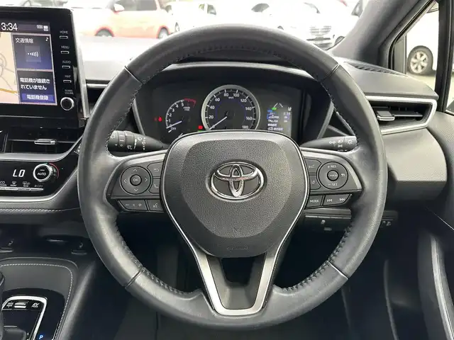 トヨタ カローラ スポーツ ハイブリッドG 三重県 2020(令2)年 5万km ホワイトパールクリスタルシャイン 純正9インチディスプレイオーディオ(車載ナビ機能有)/6スピーカー（AM/FM/Bluetooth/Miracast/TV）/バックカメラ/シートヒーター（前席）/トヨタセーフティセンス（プリクラッシュセーフティセンス/レーントレーシングアシスト/レーダークルーズコントロール/オートマチックハイビーム/ロードサインアシスト）/ETC/ブラインドスポットッモニター/左右独立式温度調整オートエアコン/スマートエントリー/スタートシステム/角形3灯式LEDヘッドランプ/ガンメタリック枠付ガンメタリックハニカムメッシュフロントグリル/メッキサイドウインドウモールディング/ブラックセンターピラーガーニッシュ/ホワイトステッチ入合皮革巻きダッシュボード/サテンメッキインパネ加飾/サテンメッキ加飾付ピアノブラックオーディオパネル/シルバーインサイドドアハンドル/シルバー加飾付革巻きシフトノブ/サテンメッキ加飾付アナログメーター/4.2インチカラーマルチインフォメーションディスプレイ/ブラックファブリックシート/スポーティシート（前席）/革巻きステアリングホイール