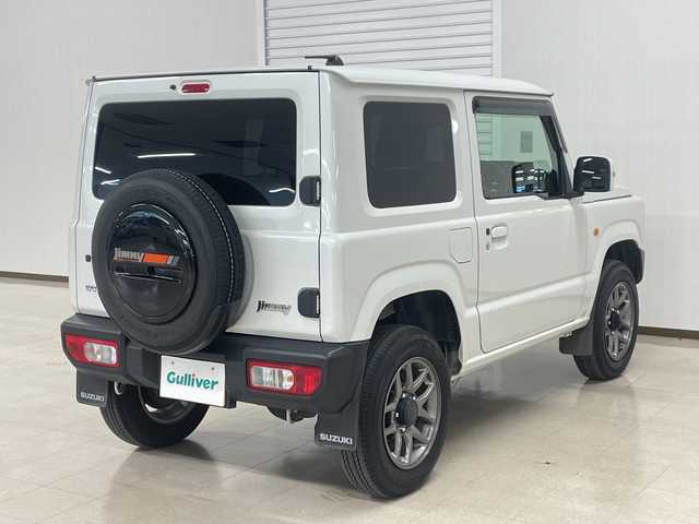 スズキ ジムニー XC 熊本県 2023(令5)年 2.6万km ピュアホワイトP 衝突軽減システム　/社外ナビ(ＣＤ/ＤＶＤ/ＴＶ)　/シートカバー　/前席シートヒーター　/クルーズコントロール/ＬＥＤヘッドライト　/ヒーテッドドアミラー　/オートライト　/背面タイヤ　/前後ドライブレコーダー/4WD　/純正アルミホイール　/純正フロアマット