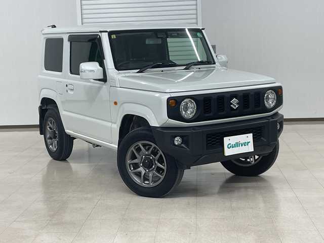 スズキ ジムニー XC 熊本県 2023(令5)年 2.6万km ピュアホワイトP 衝突軽減システム　/社外ナビ(ＣＤ/ＤＶＤ/ＴＶ)　/シートカバー　/前席シートヒーター　/クルーズコントロール/ＬＥＤヘッドライト　/ヒーテッドドアミラー　/オートライト　/背面タイヤ　/前後ドライブレコーダー/4WD　/純正アルミホイール　/純正フロアマット