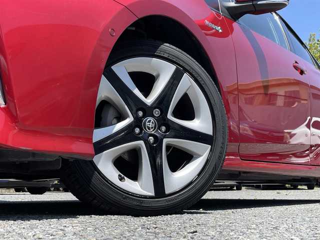 トヨタ プリウス A プレミアム　ツーリングセレ 東京都 2016(平28)年 6.9万km エモーショナルレッド 純正メモリナビ（DSZT-YC4T）/・フルセグTV/DVD/Bluetoothオーディオ/バックカメラ/本革シート/・前席シートヒーター/Toyota Safety Sense P/・プリクラッシュセーフティシステム/・レーンディパーチャーアラート（ステアリング制御付）/・オートマチックハイビーム/・レーダークルーズコントロール（全車速追従機能付）/ブラインドスポットモニター/カラーヘッドアップディスプレイ/AC100V1500W/LEDヘッドランプ/フロアマット/保証書/スペアキー