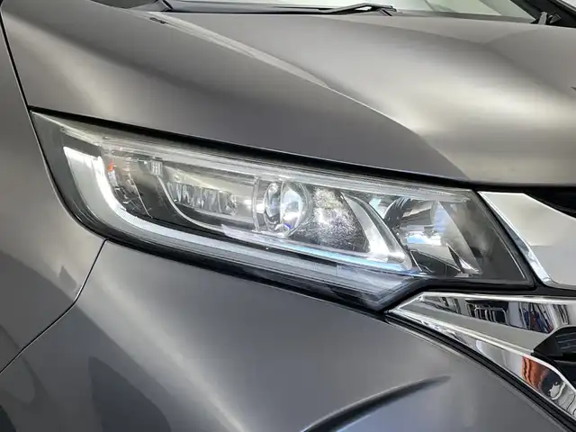 ホンダ フリード ハイブリット G ホンダセンシング 新潟県 2016(平28)年 2.7万km モダンスティールM ワンオーナー/禁煙車/純正メモリナビ/（BT/FM/AM/フルセグTV）/バックカメラ/ステアリングスイッチ/ハーフレザーシート/両側パワースライドドア/ワイパーデアイサー/先行車発進お知らせ装置/サンシェード/純正LEDオートヘッドライト/フロントフォグ/電格ミラー/ドアバイザー/ETC/取扱説明書/保証書