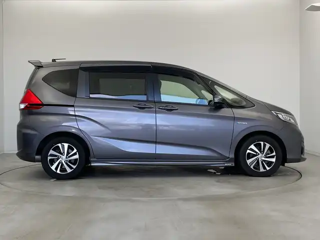 ホンダ フリード ハイブリット G ホンダセンシング 新潟県 2016(平28)年 2.7万km モダンスティールM ワンオーナー/禁煙車/純正メモリナビ/（BT/FM/AM/フルセグTV）/バックカメラ/ステアリングスイッチ/ハーフレザーシート/両側パワースライドドア/ワイパーデアイサー/先行車発進お知らせ装置/サンシェード/純正LEDオートヘッドライト/フロントフォグ/電格ミラー/ドアバイザー/ETC/取扱説明書/保証書