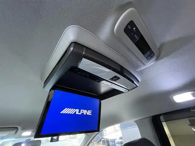 日産 エルグランド 250ハイウェイスター 滋賀県 2013(平25)年 4.9万km ブリリアントホワイトパール 社外８インチナビ/Bluetooth/CD/DVD/USB/フルセグ/ハーフレザー/両側電動スライド/パワーリアゲート/２列目オットマン/フリップダウンモニター/ドラレコ（前後）/バックカメラ/オートライト/プッシュスタート/スマートキー/ステアリングリモコン/ETC