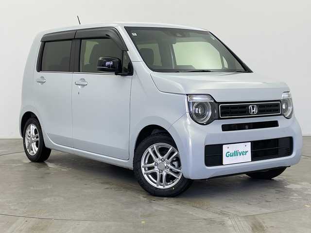 ホンダ Ｎ ＷＧＮ L スタイル+ビター 富山県 2024(令6)年 0.3万km プレミアムサンライトホワイトパール ワンオーナー/社外ナビ【AVIC-RZ812】/（AM/FM/CD/DVD/SD/USB/BT）/フルセグTV/バックカメラ/鉄チン付き夏タイヤ積込/衝突被害軽減ブレーキ/アダプティブクルーズコントロール/レーンキープアシスト/オートマチックハイビーム/LEDヘッドライト/リアパーキングセンサー/ハーフレザーシート/前席シートヒーター/スマートキー×２/プッシュスタート/アイドリングストップ/純正フロアマット/ドアバイザー/取扱説明書/保証書