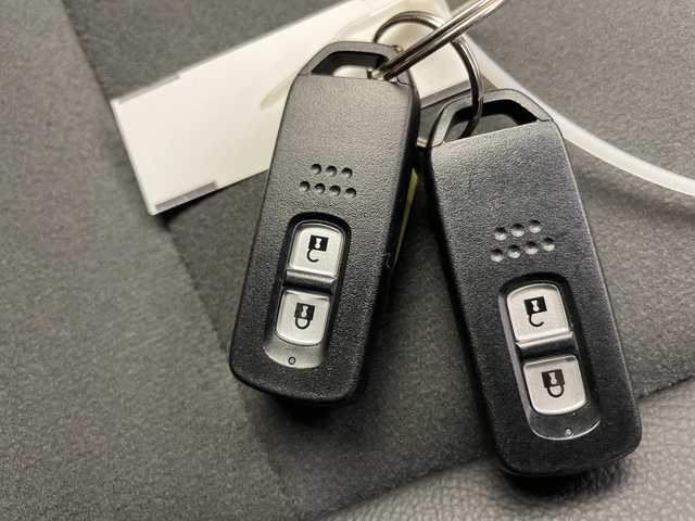 ホンダ Ｎ ＷＧＮ L スタイル+ビター 富山県 2024(令6)年 0.3万km プレミアムサンライトホワイトパール ワンオーナー/社外ナビ【AVIC-RZ812】/（AM/FM/CD/DVD/SD/USB/BT）/フルセグTV/バックカメラ/鉄チン付き夏タイヤ積込/衝突被害軽減ブレーキ/アダプティブクルーズコントロール/レーンキープアシスト/オートマチックハイビーム/LEDヘッドライト/リアパーキングセンサー/ハーフレザーシート/前席シートヒーター/スマートキー×２/プッシュスタート/アイドリングストップ/純正フロアマット/ドアバイザー/取扱説明書/保証書