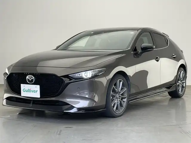 マツダ マツダ３ファストバック XD バーガンディセレクション 愛知県 2021(令3)年 4.5万km チタニウムフラッシュマイカ 純正ナビ　フルセグＴＶ　ＨＤＭＩ　ＢＴ　DVD　純正スポイラー　バーガンディ専用赤革シート　シートヒーター　ステアリングヒーター　バックカメラ　ＥＴＣ　衝突軽減装置　追従クルコン　ＬＥＤオートライト　パドルシフト　ＢＳＭ　コーナーセンサー　パワーシート　メモリシート　アイドリングストップ　電動パーキング　オートホールド　禁煙車