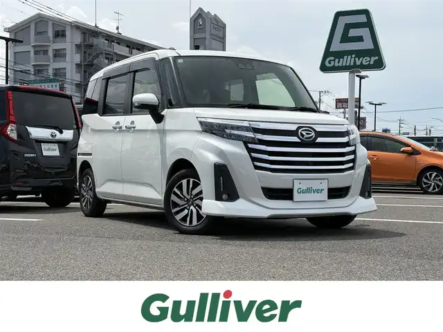 ダイハツ トール カスタムG 大分県 2020(令2)年 3.9万km パールホワイトⅢ 社外ナビ【CN-RA06WD】/　CD/DVD/フルセグTV/BT/パノラマモニター/両側パワースライドドア/スマートキー/プッシュスタート/スマートアシスト/　・衝突警報機能（対車両・対歩行者）/　・衝突回避支援ブレーキ機能/　・ブレーキ制御付き誤発進抑制機能/　・車線逸脱警報機能/　・路外逸脱警報/　・ふらつき警報/　・先行車発進お知らせ機能/　・全車速追従機能付きACC/革巻きステアリング/ステアリングスイッチ/純正LEDヘッドライト/純正14インチアルミ/コーナーセンサー/ETC/保証書/取扱説明書