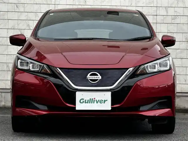 日産 リーフ X 10万台記念車 大分県 2018(平30)年 6.9万km ラディアントレッド 純正SDナビ（QY86-55ND）/Bluetooth/フルセグ/CD/DVD/BOSEサウンド/シートヒーター（D＋N席）/プロパイロット/ステアリングヒーター/純正アルミホイル17インチ/本革シート/純正フロアマット/スペアキー/バックカメラ/ETC/UVカットガラス