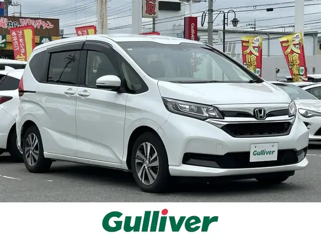 ホンダ フリード G ホンダセンシング 群馬県 2022(令4)年 3.8万km プラチナホワイトパール Sパッケージ/ナビ装着用スペシャルパッケージ/カロッツェリアナビ/CD・DVD・SD/Bluetooth・フルセグTV/10.2型フリップダウンモニター/両側パワースライドドア/バックカメラ/前後ドライブレコーダー/ビルトインETC/前席シートヒーター/クルーズコントロール/横滑り防止装置/レーンキープアシスト/衝突軽減ブレーキ/アイドリングストップ/純正アルミホイール/LEDヘッドライト/オートリトラミラー/センターテーブル/取説・保証書/スマートキー×2