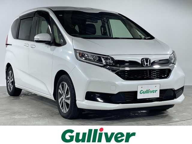 ホンダ フリード G ホンダセンシング 福岡県 2022(令4)年 3.8万km プラチナホワイトパール Sパッケージ/ナビ装着用スペシャルパッケージ/カロッツェリアナビ/CD・DVD・SD/Bluetooth・フルセグTV/10.2型フリップダウンモニター/両側パワースライドドア/バックカメラ/前後ドライブレコーダー/ビルトインETC/前席シートヒーター/クルーズコントロール/横滑り防止装置/レーンキープアシスト/衝突軽減ブレーキ/アイドリングストップ/純正アルミホイール/LEDヘッドライト/オートリトラミラー/センターテーブル/取説・保証書/スマートキー×2