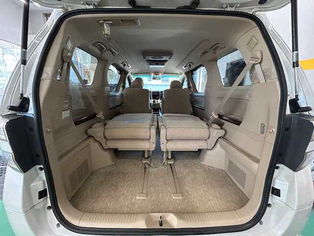 トヨタ ヴェルファイア 2．4V 宮城県 2009(平21)年 18万km ホワイトパールクリスタルシャイン 純正ナビ/AM/FM/BT/CD/DVD/AUX/ワンセグTV/バックカメラ/社外フリップダウンモニター/前席パワーシート/オットマン/両側パワースライドドア/ステアリングスイッチ/MTモード搭載/コーナーセンサー/クルーズコントロール/横滑り防止装置/衝突被害軽減システム/純正フロアマット/ウィンカードアミラー/プッシュスタート/保証書・記録簿・取扱説明書