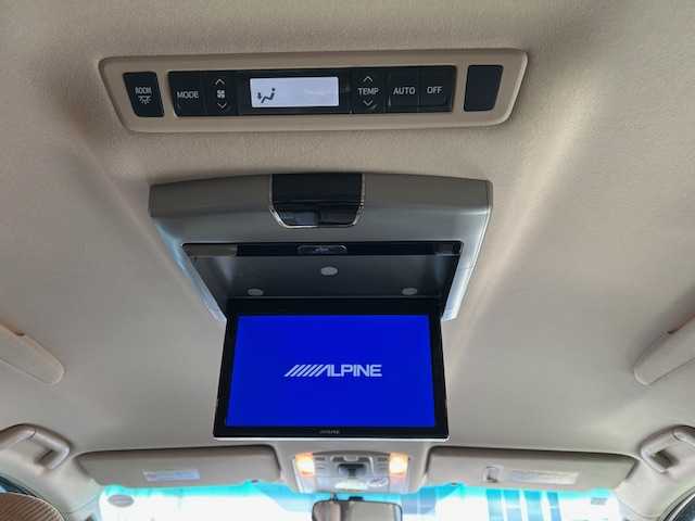 トヨタ ヴェルファイア 2．4V 宮城県 2009(平21)年 18万km ホワイトパールクリスタルシャイン 純正ナビ/AM/FM/BT/CD/DVD/AUX/ワンセグTV/バックカメラ/社外フリップダウンモニター/前席パワーシート/オットマン/両側パワースライドドア/ステアリングスイッチ/MTモード搭載/コーナーセンサー/クルーズコントロール/横滑り防止装置/衝突被害軽減システム/純正フロアマット/ウィンカードアミラー/プッシュスタート/保証書・記録簿・取扱説明書