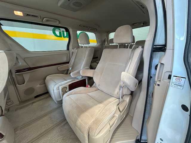 トヨタ ヴェルファイア 2．4V 宮城県 2009(平21)年 18万km ホワイトパールクリスタルシャイン 純正ナビ/AM/FM/BT/CD/DVD/AUX/ワンセグTV/バックカメラ/社外フリップダウンモニター/前席パワーシート/オットマン/両側パワースライドドア/ステアリングスイッチ/MTモード搭載/コーナーセンサー/クルーズコントロール/横滑り防止装置/衝突被害軽減システム/純正フロアマット/ウィンカードアミラー/プッシュスタート/保証書・記録簿・取扱説明書