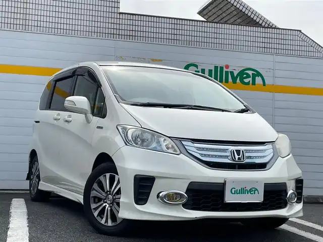 ホンダ フリード ハイブリット ジャストセレクション 埼玉県 2012(平24)年 13.6万km プレミアムホワイトパール /ワンオーナー//純正メモリナビ//ワンセグTV//バックカメラ//CD/DVD//両側パワースライドドア//クルーズコントロール//ETC//スマートキー//キセノン//ハーフレザーシート//革巻きステアリング//Wエアバッグ//ABS//横滑り防止装置//オートライト//Fフォグランプ//プライバシーガラス//ドアバイザー//純正15インチAW//新車時保証書//取扱説明書//ナビ取説