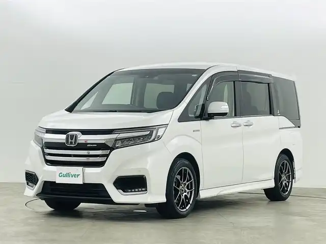 ホンダ ステップワゴン スパーダ ハイブリッド G EX ホンダセンシング 福島県 2018(平30)年 9万km プラチナホワイトパール ホンダセンシング　/・CMBS/・車線逸脱警報/・標識認識機能/・誤発信抑制機能/・レーダークルーズコントロール/純正１０インチナビゲーション/【AM/FM/DVD/CD/Bluetooth/フルセグ】　/全方位カメラ　/ＥＴＣ　/純正フリップダウンモニター　/デジタルインナーミラー　/両側パワースライドドア　/ハーフレザーシート/シートヒーター　/プッシュスタート　/・スマートキー/LEDライト/・オートライト/・フォグライト