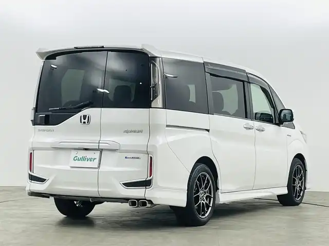 ホンダ ステップワゴン スパーダ ハイブリッド G EX ホンダセンシング 福島県 2018(平30)年 9万km プラチナホワイトパール ホンダセンシング　/・CMBS/・車線逸脱警報/・標識認識機能/・誤発信抑制機能/・レーダークルーズコントロール/純正１０インチナビゲーション/【AM/FM/DVD/CD/Bluetooth/フルセグ】　/全方位カメラ　/ＥＴＣ　/純正フリップダウンモニター　/デジタルインナーミラー　/両側パワースライドドア　/ハーフレザーシート/シートヒーター　/プッシュスタート　/・スマートキー/LEDライト/・オートライト/・フォグライト