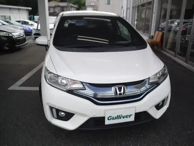 ホンダ フィット ハイブリット Sパッケージ 東京都 2013(平25)年 3.7万km パール ワンオーナー車/保証書・取説あり/純正インターナビ・TV/　DVD・BLUETOOTH/　ビルトインETC/　ドライブレコーダー/あんしんパッケージ/クルーズコントロール/コンフォートビューパッケージ/アームレストコンソール/パーキングセンサー/パドルシフト/LEDヘッドライト/スマートキー×2個