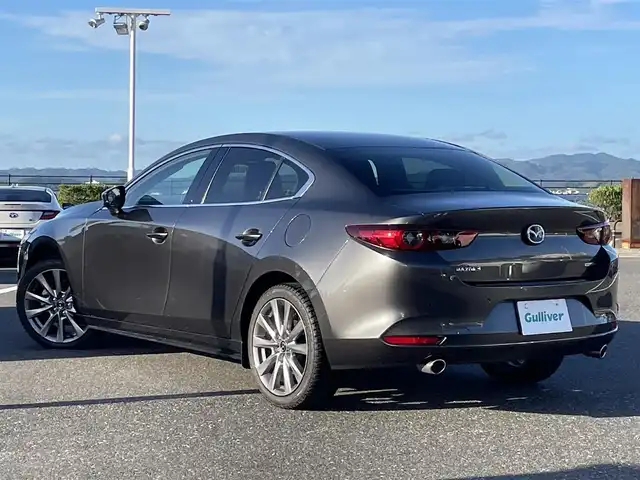 マツダ マツダ３セダン XD Lパッケージ 島根県 2021(令3)年 2.7万km マシーングレープレミアムM 登録時走行距離 26852km/BOSEサウンド/純正ナビ/(Bluetooth/AM/FM/フルセグテレビ/CD/DVD)/追従型クルーズコントロール/レーンキープアシスト/コーナーセンサー/ブラインドスポットモニター/ヘッドアップディスプレイ/全周囲カメラ/パワーシート/メモリーシート/シートヒーター/オートマチックハイビーム/オートライト/純正フロアマット/ETC/純正アルミ１８インチ