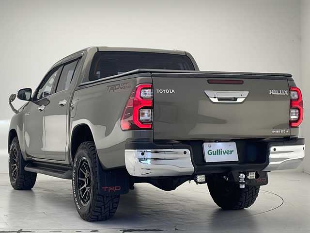 トヨタ ハイラックス Z 大分県 2023(令5)年 2.1万km オキサイドブロンズM 社外メモリナビ（CN-HE01WD)/　CD/DVD/SD/BT/フルセグ/バック・フロントカメラ/ETC/前後ドライブレコーダー/トヨタセーフティセンス/ダウンヒルアシストコントロール/リヤデフロック/アイドリングストップ/LEDヘッドライト/オートライト/社外17インチAW/社外フロアマット/純正ベッドライナー/トノカバー/TRDマッドフラップ/ヒッチメンバー/プッシュスタート/スマートキ―