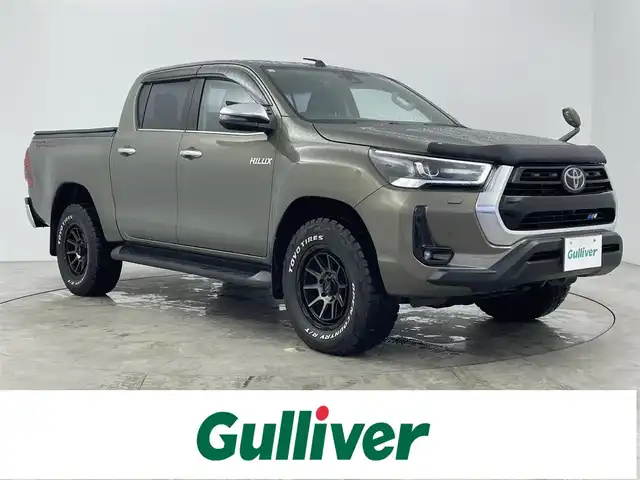 トヨタ ハイラックス Z 大分県 2023(令5)年 2.1万km オキサイドブロンズM 社外メモリナビ（CN-HE01WD)/　CD/DVD/SD/BT/フルセグ/バック・フロントカメラ/ETC/前後ドライブレコーダー/トヨタセーフティセンス/ダウンヒルアシストコントロール/リヤデフロック/アイドリングストップ/LEDヘッドライト/オートライト/社外17インチAW/社外フロアマット/純正ベッドライナー/トノカバー/TRDマッドフラップ/ヒッチメンバー/プッシュスタート/スマートキ―