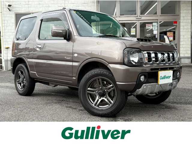 スズキ ジムニー クロスアドベンチャー 埼玉県 2012(平24)年 4.8万km シフォンアイボリーM SDナビ(ワンセグ/DVD/CD/AM/FM/USB)/背面タイヤ/パートタイム4WD/ターボ/ハーフレザーシート/シートヒーター/ETC/ABS/純正フロアマット/純正アルミホイール/ドアバイザー/フォグランプ/パワーステアリング/パワーウィンドウ/保証書/取扱説明書/スペアキー