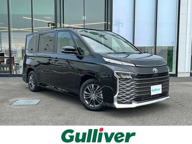 トヨタ ヴォクシー S－G 愛媛県 2023(令5)年 2万km アティチュードブラックマイカ 純正ディスプレイオーディオ/両側パワースライドドア/ETC2.0/クルーズコントロール/コーナーセンサー前後/オートハイビーム/オートライト/LED/レーンキープアシスト/バックカメラ/ウォークスルー/純正16AW/Bluetooth/スマートキー