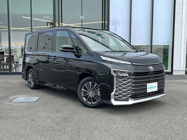 トヨタ ヴォクシー S－G 愛媛県 2023(令5)年 2万km アティチュードブラックマイカ 純正ディスプレイオーディオ/両側パワースライドドア/ETC2.0/クルーズコントロール/コーナーセンサー前後/オートハイビーム/オートライト/LED/レーンキープアシスト/バックカメラ/ウォークスルー/純正16AW/Bluetooth/スマートキー