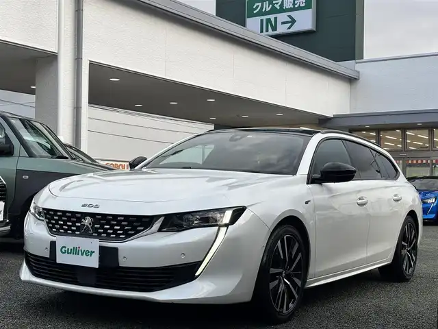 プジョー ５０８ SW GT ブルーHDi 熊本県 2020(令2)年 6.3万km BLANC NACRE サンルーフ/FOCALスピーカー/純正ナビ付ディスプレイオーディオ/【フルセグTV/Bluetooth/AM/FM】/全周囲カメラ/バックカメラ/衝突軽減防止装置/レーンキープアシスト/ブラインドスポットモニター/コーナーセンサー/パドルシフト/パワーバックドア/革巻きステアリング/ステアリングスイッチ/レザーシート/前席パワーシート/純正18インチAW/プッシュスタート/スマートキー/盗難防止装置/取扱説明書
