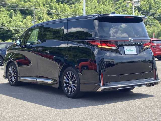 トヨタ ヴェルファイア ハイブリット Z プレミア 佐賀県 2023(令5)年 4.1万km ブラック モデリスタエアロ/Wムーンルーフ/純正１４インチディスプレイオーディオ/ナビキット/純正フリップダウンモニター/プリクラッシュセーフティ/Advanced　Drive　/ロードサインアシスト/フロントクロストラフィックアラート/リアクロストラフィックアラート/レーンディパーチャーアラート/レーンチェンジアシスト/アダプティブクルーズコントロール/ブラインドスポットモニター/クリアランスソナー/両側パワースライドドア/ヘッドアップディスプレイ/パワーバックドア/レザーシート/メモリ付きパワーシート/シートヒーター/エアシート/オットマン/スマートルームミラー/電動パーキングブレーキ/オートブレーキホールド/置くだけ充電/ドライブレコーダー/ビルトインETC/プッシュスタート/スマートキー/LEDヘッドライト/シーケンシャルウィンカー/純正アルミホイール/ユニバーサルステップ
