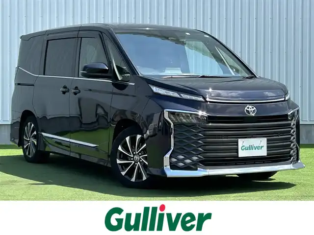 トヨタ ヴォクシー S－Z 香川県 2022(令4)年 2.4万km スパークリングブラックパールクリスタルシャイン 登録時走行距離：23196km/メーカー純正ナビ/　CD DVD BT フルセグTV/全方位カメラ/モデリスタフルエアロ/両側パワースライドドア/パワーバックドア/プリクラッシュセーフティシステム/レーンキープアシスト/レーダークルーズコントロール/ブラインドスポットモニター/クリアランスソナー/パーキングアシスト/オートハイビーム/LEDヘッドライト/オートライト/レベライザヘッドライト/MTモード付AT/電子パーキングブレーキ/横滑り防止装置/前後ドライブレコーダー/ビルトインETC/ハーフレザーシート/シートヒーター/革巻きステアリング/ステアリングスイッチ/プッシュスタート/スマートキー