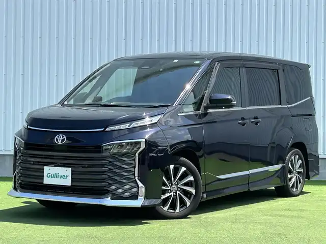 トヨタ ヴォクシー S－Z 香川県 2022(令4)年 2.4万km スパークリングブラックパールクリスタルシャイン 登録時走行距離：23196km/メーカー純正ナビ/　CD DVD BT フルセグTV/全方位カメラ/モデリスタフルエアロ/両側パワースライドドア/パワーバックドア/プリクラッシュセーフティシステム/レーンキープアシスト/レーダークルーズコントロール/ブラインドスポットモニター/クリアランスソナー/パーキングアシスト/オートハイビーム/LEDヘッドライト/オートライト/レベライザヘッドライト/MTモード付AT/電子パーキングブレーキ/横滑り防止装置/前後ドライブレコーダー/ビルトインETC/ハーフレザーシート/シートヒーター/革巻きステアリング/ステアリングスイッチ/プッシュスタート/スマートキー