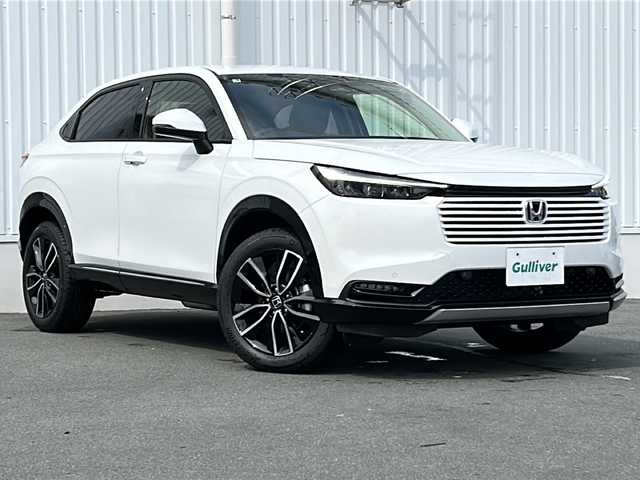 ホンダ ヴェゼル ハイブリッド e:HEV Z 三重県 2025(令7)年 0.1千km プラチナホワイトパール 登録済未使用車 /純正ナビ /バックカメラ/BSM /ワイヤレス充電器 /ビルトインETC2.0 /パワーバックドア /ステアリングヒーター/スペアキー /コーナーセンサー /レーダークルーズコントロール/レーンキープアシスト/USB・タイプC給電/シートヒーター /ハーフレザー /LEDヘッドライト/オートハイビーム/オートライト/禁煙車