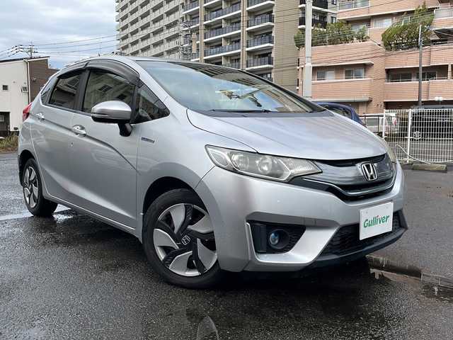 ホンダ フィット ハイブリット Lパッケージ 宮崎県 2015(平27)年 9.1万km アラバスターシルバーメタリック 純正メモリーナビ/ワンセグテレビ/バックカメラ/クルーズコントロール/プッシュスタート/ETC/CDチェンジャー/パワーウインドウ/パワーステアリング/スマートキー/純正フロアマット/純正アルミホイール