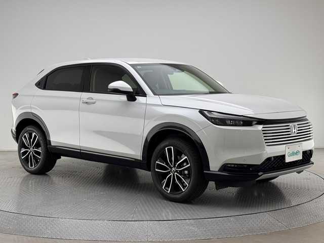 ホンダ ヴェゼル ハイブリッド e:HEV Z 兵庫県 2025(令7)年 0.1千km プラチナホワイトパール e:HEV Z　3VC4AG3　Honda CONNECTディスプレー+ETC2.0車載器+ワイヤレス充電器(220/000)/純正メモリーナビ（フルセグ・BT・カープレイ）/バックカメラ/追従式クルーズコントロール/パワーバックドア/純正18インチAW/ハーフレザーシート/シートヒーター（D/N席）/オートライト/オートハイビーム/前後コーナーセンサー/LEDヘッドランプ/BSM/PCS/レーンキープ/置くだけ充電/パドルシフト