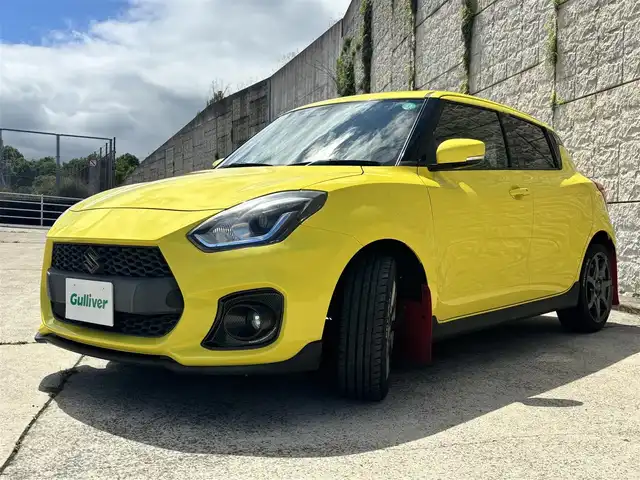スズキ スイフト スポーツ セーフティPKG 長崎県 2018(平30)年 6.4万km チャンピオンイエロー 社外メモリナビ/(CD/DVD/フルセグ)/衝突軽減ブレーキ/レーンアシスト/レーダークルーズ/シートヒーター/ETC/ENKEI17インチAW/HKSマフラーカッター/社外ツイーター/ドライブレコーダー/マッドガード