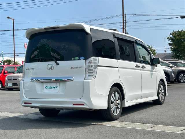 ホンダ ステップワゴン スパーダ Z 静岡県 2014(平26)年 11.3万km ホワイトオーキッドパール 純正ナビ/両側パワスラ/バックカメラ/クルーズコントロール/純正アルミホイール/ビルトインＥＴＣ/パワーステアリング/パワーウィンドウ/ＭＴモード付きＡＴ/アイドリングストッップ/Ｂｌｕｅｔｏｏｔｈ接続/ＡＢＳ/ウォークスルー/チップアップシート/横滑り防止装置/オートライト