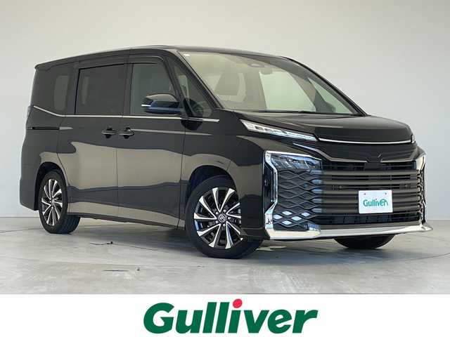 トヨタ ヴォクシー ハイブリッド S－Z 愛知県 2023(令5)年 1万km アティチュードブラックマイカ 純正10.5型ディズプレイオーディオナビ/両側パワースライドドア/レーダークルーズコントロール/シートヒーター/バックカメラ/電動リアゲート/コーナーセンサー/純正アルミホイール/ETC2.0/LEDヘッドライト/リアオートエアコン/LEDヘッドライト/ドライブレコーダー/衝突軽減システム/フルセグ/CD DVD/Bluetooth/ステアリングスイッチ/スマートキー/プッシュスタート